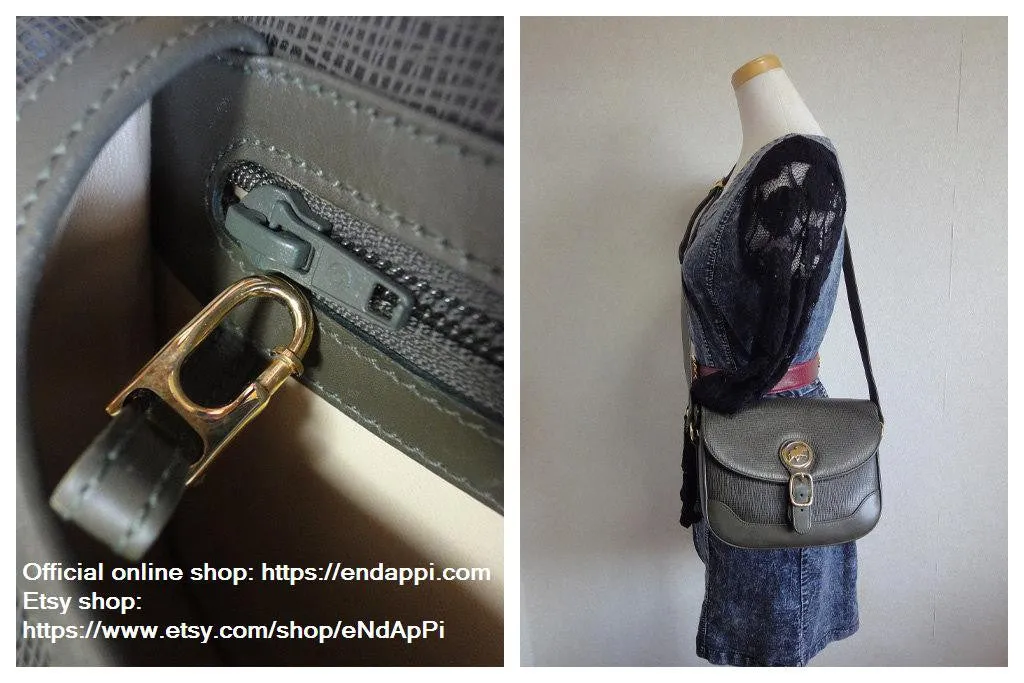 Vintage Hunting World khaki genuine leather shoulder purse with iconic gold tone elephant logo charm at front